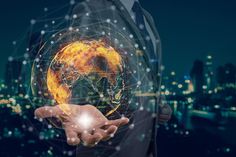 a man in a suit holding out his hand with a glowing globe on the background