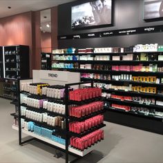 a store with shelves full of cosmetics and other items in it's display area