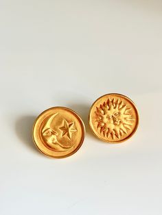 Rare Anne Klein matte gold celestial moon and sun mismatched earrings . approx 1" round. Nice vintage condition. post back. signed. Please Note: All of these items are vintage. They have been pre-loved and are not in pristine condition. I try to take photos of any areas of concern. Please ask for more photos if you have any concerns about the condition of a piece. Returns will only be accepted if there is damage in shipping. Celestial Gold Round Earrings, Gold Celestial Round Earrings, Vintage Moon-shaped Earrings For Gift, Vintage Moon Shaped Earrings For Gift, Vintage Moon Earrings For Gift, Gold Celestial Earrings With Sun And Moon Design, Gold Symbolic Moon Charm Earrings, Gold Symbolic Earrings With Moon Charm, Symbolic Gold Earrings With Moon Charm