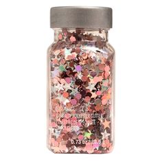 a jar filled with lots of different colored confetti