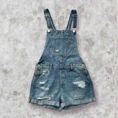 These Overalls Will Be Your New Favorite! They’re Super Comfy And Trendy! Snag Yourself A Pair Of These Medium Wash Distressed Denim Overalls! Perfect For Relaxing On The Weekend. True To Size High Rise Short Overalls Distressed Denim Material 100% Cotton Shown In A Size Small Side Buttons Front & Side Pockets Closure At The Top Care Instructions: Machine Wash With Cold Water From Kiyana Boutique Approximate Measurements: Waist: Small: 32 Inches Medium: 34 Inches Large: 36 Inches Length: Small: 29 Inches Medium: 31 Inches Large: 33 Inches Inseam: 3 In Front Rise (S): 10 ¾ Fancy Romper, Light Blue Romper, Olive Green Romper, Free People Romper, Black White Jumpsuit, Spaghetti Strap Rompers, Strap Pants, Boutique Pants, Short Overalls