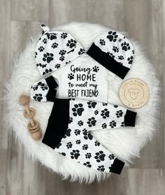 a white and black dog pajamas with the words going home to meet my best friend