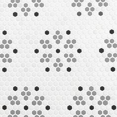 an abstract white and black pattern with hexagonal dots on it's surface