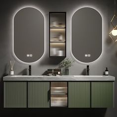 a bathroom vanity with two mirrors and lights on it's sides, in front of a gray wall