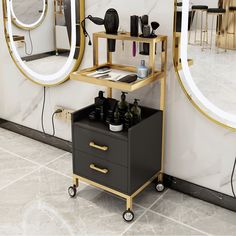 a black and gold vanity with mirrors on the wall next to it is an open drawer that holds personal care items