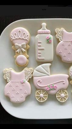 baby shower cookies are arranged on a plate