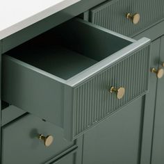 an open drawer in the middle of a cabinet