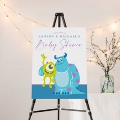 an easel with a baby shower sign on it