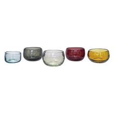 four different colored glass bowls sitting side by side