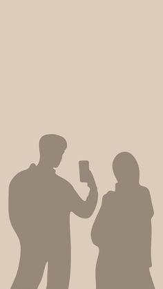 two people standing next to each other in the shadow with one holding a drink cup