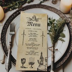 a menu sitting on top of a white plate next to silverware and candle holders