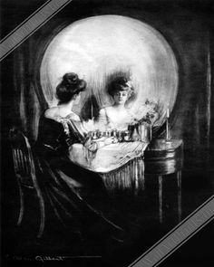 two women sitting at a table in front of a mirror