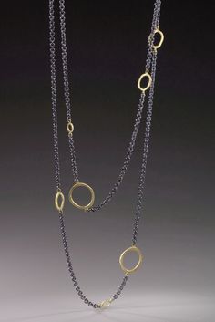 Floating Dig Circle Necklace by Dahlia Kanner. This patinated sterling silver necklace is adorned with a series of loops that add a playful touch to the 36L chain, which can be worn long or doubled, as shown. Choose 18k gold or patinated silver loops (not shown). 0.5W Elegant Double Strand Necklaces With Unique Variations, Necklace Art, Elegant Hand Cast Necklaces, Elegant Hand Forged Chain Necklace Gift, Elegant Hand Cast Bronze Necklace, Elegant Hand Forged Oval Link Necklaces, Elegant Brass Jewelry For Layering, Silver Double Strand Jewelry For Evening, Modern Oxidized Finish Formal Necklace