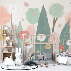 a child's room decorated in pastel colors with trees and flowers on the wall