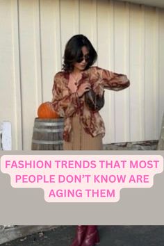 a woman standing in front of a barrel with text overlay that reads fashion trends that most people don't know are aging them