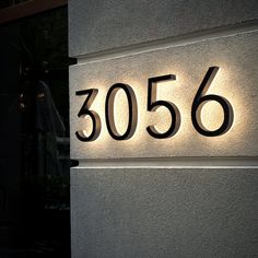 the number 3506 is lit up on the side of a building