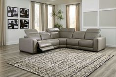 a living room with a sectional couch and rug