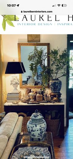 a living room filled with lots of furniture and decor on top of a hard wood floor