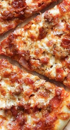 several slices of pizza sitting on top of a cutting board