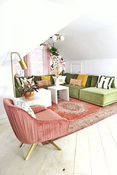 a living room filled with lots of furniture next to a large rug on top of a hard wood floor