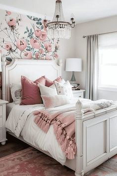 a bedroom with pink and white decor on the walls