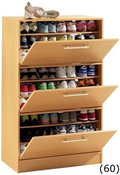 the shoe rack has five drawers and three pairs of shoes on it's sides