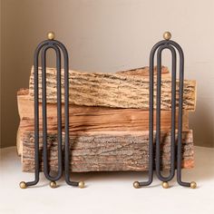 three metal and wood stand on top of each other