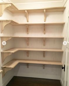 empty shelves in the corner of a room