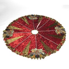 a decorative red and gold plate with floral designs