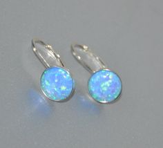 "Shop Leverback Earrings, Blue Opal Earrings Sterling Silver, Opal Jewelry Looking for opal jewelry? Opal is October birthstone. Shop Lever Back Earrings, Opal Earrings Sterling Silver, October Birthstone, 8mm Stone, Beaded Bridal Opal Jewelry. Opal earrings will bring a perfect touch of flair and splash of magnificent color to your outfit! Arrays of different colors are captured in beautiful opal cabochons. They look very mysterious. Lever back earrings are very light and comfortable. It will m Opal Jewelry With Matching Earrings For Anniversary, Anniversary Opal Jewelry With Matching Earrings, Silver Opal Earrings For Wedding, Adjustable Nickel-free Opal Earrings, Hypoallergenic Round Opal Jewelry, Elegant Adjustable Opal Earrings, Hypoallergenic Opal Round Earrings, Opal Ear Wire Earrings For Gift, Opal Earrings With Ear Wire For Gift