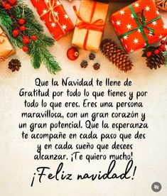 a christmas card with presents and pine cones on the bottom, in spanish that reads feliz navidad