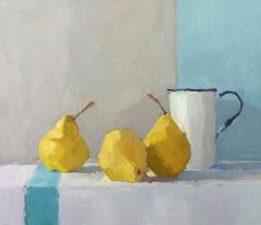 three pears are sitting on a table next to a coffee cup and blue block