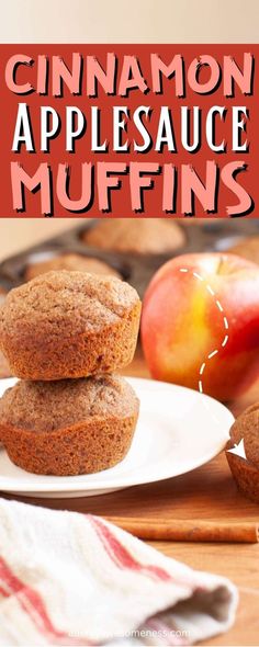 cinnamon applesauce muffins on a plate with an apple in the background