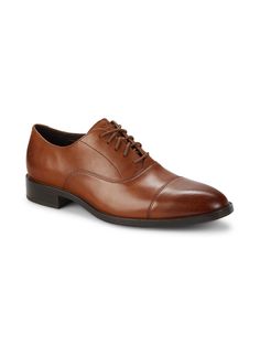 Leather Upper Almond Cap Toe Lace-Up Vamp Lining: Leather & Textile Synthetic Sole Imported. Center Core - M Core Shoes > Saks Off 5th. Cole Haan. Color: British Tan. Size: 9. Leather Cap Toe Oxfords For Fall, Spring Cap Toe Oxfords With Branded Insole, Spring Leather Fitted Oxfords, Spring Leather Oxfords, Classic Leather Oxfords For Fall, Classic Synthetic Leather Shoes For Spring, Fall Cap Toe Leather Shoes For Workwear, Fall Cap Toe Leather Work Shoes, Classic Brown Synthetic Leather Shoes