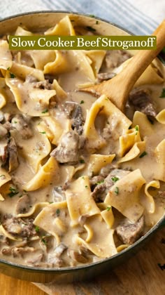 a skillet filled with pasta and meat in a creamy sauce that is ready to be eaten