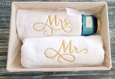 two personalized towels in a box with the word mr and mrs written on them