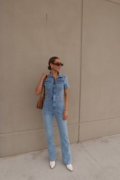 Introducing our Chelsey Denim Jumpsuit, a versatile and stylish addition to your wardrobe. Denim Overalls For Day Out, Chic Denim Overalls For Day Out, Fitted Denim Blue Jumpsuits And Rompers For Day Out, Fitted Denim Jumpsuits And Rompers For Day Out, Light Wash Denim Overall Jumpsuit For Day Out, Medium Wash Overall Jumpsuit For Day Out, Chic Medium Wash Overall Jumpsuits And Rompers, Medium Wash Overall Jumpsuits And Rompers For Day Out, Trendy Fitted Washed Blue Denim Jumpsuit