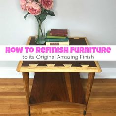 a table with flowers and books on it in front of a white wall that says how to refinish furniture to its original amazing finish