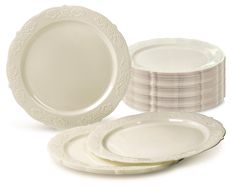 a stack of white dinner plates next to each other