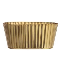 a gold foil cupcake pan with pleated edges on a white background for decoration