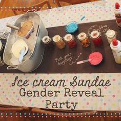 an ice cream and sundae gender reveal party sign on a table with confetti