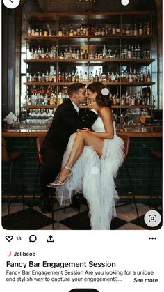 a man and woman sitting in front of a bar