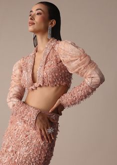 Slip into the epitome of elegance with our peach embroidered fish cut skirt set. A beautiful balance of grace and sophistication the short jacket is designed with intricate self zardosi embellishments. Flaunting a chic fish cut silhouette skirt and draped sleeves on the blouse the rich and opulent artistic embroidery creates a timeless appeal. Dry clean only if required. Slight variation in color is possible due to digital photography. Pink Embellished Blouse Piece For Evening, Elegant Peach Sharara With Traditional Drape, Elegant Designer Peach Lehenga, Elegant Peach Designer Wear Lehenga, Fitted Sharara With Pearl Embroidery, Elegant Peach Lehenga With Zari Work, Elegant Peach Sets With Zari Work, Elegant Long Sleeve Evening Choli, Pink Semi-stitched Choli For Evening