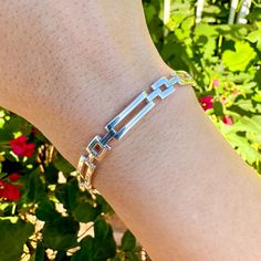 This bracelet features a striking modern, geometric design with alternating square and rectangle links. With a perfect balance of modern style and timeless elegance, this piece is both eye-catching and versatile. It's a unique addition to any jewelry collection, ideal for those who appreciate clean lines and contemporary design. Length: Available in 7" or 8" Material: Solid 925 Italian Sterling Silver Clasp Type: Lobster Clasp Modern White Gold Jewelry With Rectangular Links, Modern Link Bracelets With Polished Finish, Modern Chain Bracelet As Gift, Modern Sterling Silver Bracelet With Solid Links As Gift, Modern Chain Bracelet With Rectangular Links, Modern Sterling Silver Link Bracelet, Modern Sterling Silver Bracelet With Box Chain For Formal, Modern Sterling Silver Box Chain Bracelet For Formal Occasions, Modern Sterling Silver Bracelet With Solid Link