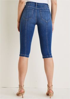 Now trending: capris! Jump on the trend with these modern jeans that flatter every figure. Hitting just below the knee, this capri style shows some leg without revealing too much. Seam details elongate your silhouette and add a fun flair to your denim collection.  * Available in plus size  * Zipper and button closure  * 17" inseam  * Cotton/viscose/spandex. Imported Fitted Knee-length Denim Jeans, Stretch Cropped Leg Jeans In Dark Wash, Stretch Dark Wash Cropped Jeans, Stretch Cropped Jeans In Dark Wash, Trendy Knee-length Dark Wash Jeans, Trendy Dark Wash Knee-length Bottoms, Trendy Medium Wash Knee-length Bottoms, Casual Fitted Knee-length Jeans, Fitted Denim Capri Length Cropped Jeans