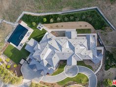 an aerial view of a large house in the country