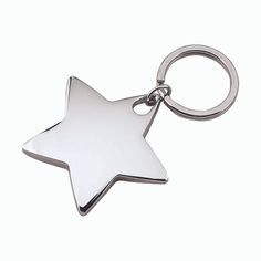 a silver star shaped key chain on a white background