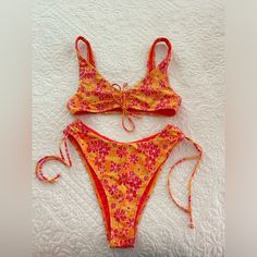 In Perfect Condition Nwot Top Xs Bottoms S Message Me If You Have Any Questions! Cheap Orange Floral Print Swimwear, Beachy Orange Tropical Print Swimwear, Orange Tropical Print Beachy Swimwear, Orange And Pink Bikinis, Orange Beachy Swimwear With Tie-side Bottom, Orange Floral Print Triangle Top Swimwear, Orange Swimsuit, Cute Swimsuits, Pink Floral