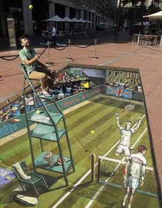 a man sitting on top of a tennis court painted to look like it is going to hit the ball