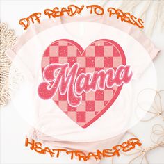 a pink heart with the word mama written in cursive font on it and some other items